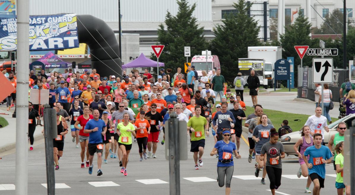 Runners starting the Coast Guard 5K race at Festival Park in Portsmouth, Virginia